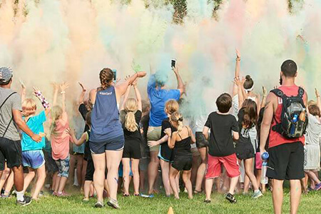 Children playing with colored powder