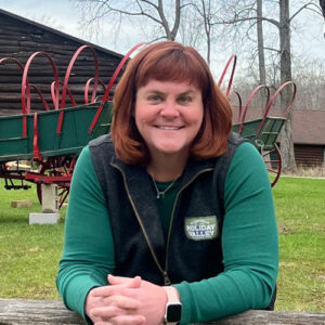 Portrait of Courtney Nicolai in front of the wagons